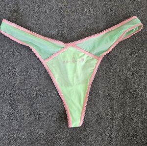 New without tags, parade green and pink thong.  Size medinum to large
